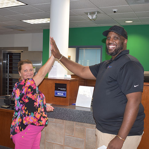 Expree employee high-fiving a member
