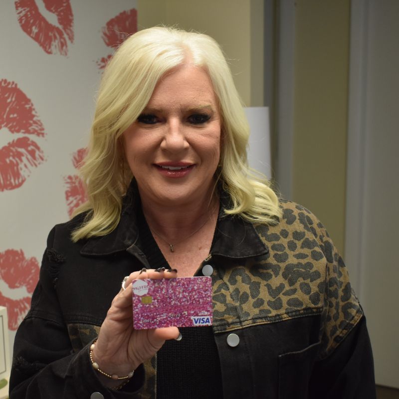 Expree Credit Union member shows off keys to her new car.